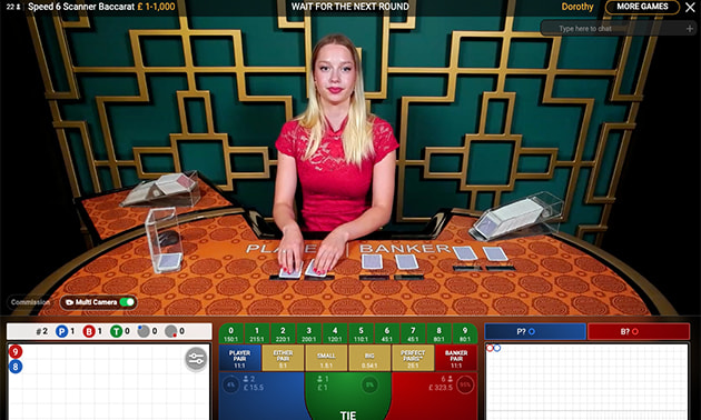 Dealer dealing cards at live Baccarat online casino table