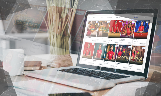 Online casino lobby on laptop showing live Baccarat tables and dealers