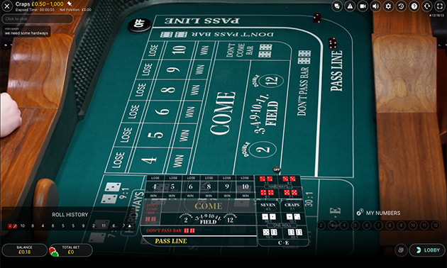 Online casino craps table layout with betting sections for pass line and come bets