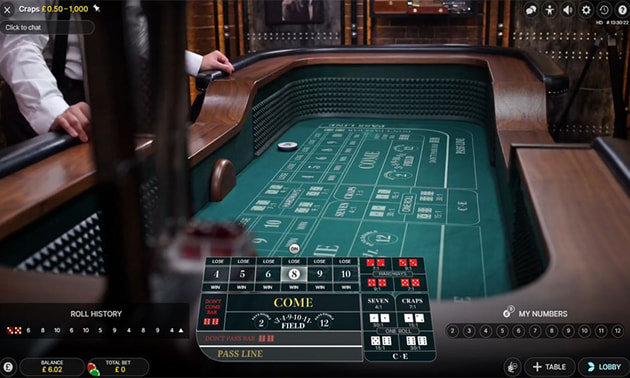 Live dealer craps online casino game showing dice table and betting layout