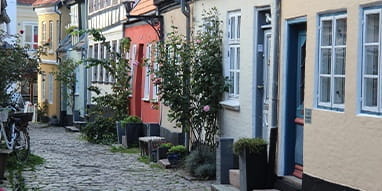 The Old Town of Aalborg with its Well-Aged Houses, Cobbled Streets and Rose Bushes. If You Visit Radisson Blue Hotels There, You Will Find a Suitable Evening Entertainment.