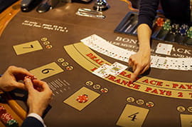 Dealer Explains Rules to Blackjack Player