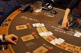 Dealer Pays Out to a Blackjack Player with Three Hands