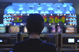 Casino Player at Slot Machines