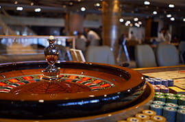 Roulette Wheel on a Casino Background
