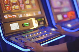 Slot Machine Player at a Real Casino