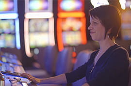 Slot Player Entertained at a Casino