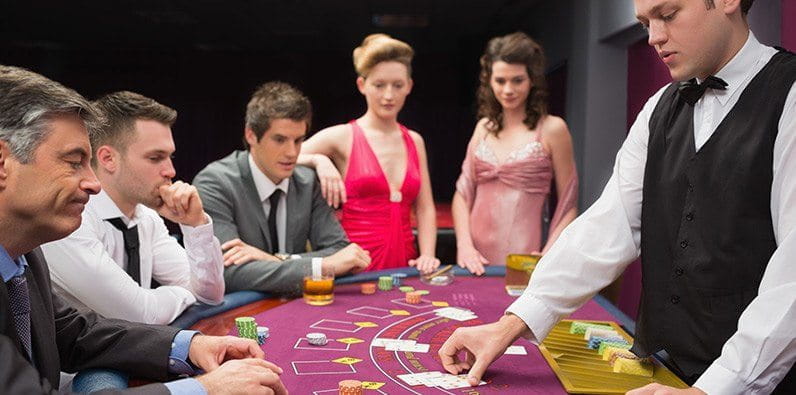 Players Trying to Beat the Dealer on a Blackjack Table