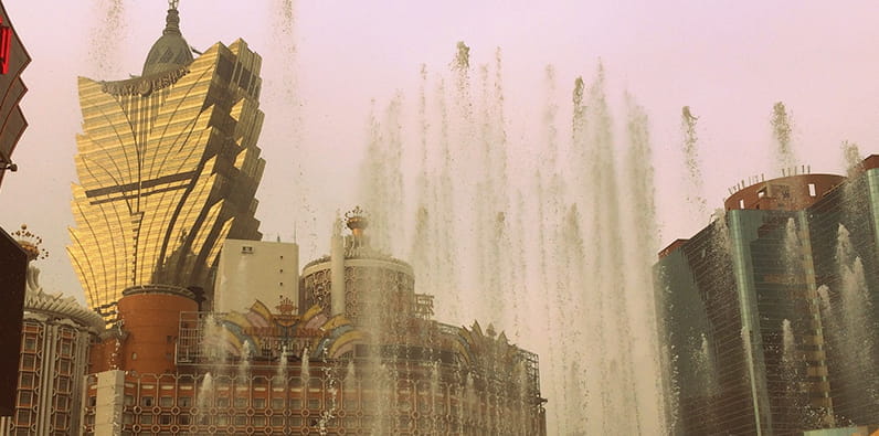 The Grand Lisboa Casino and Hotel on the Background of the Fountains
