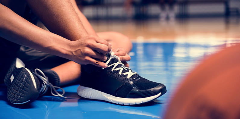 Boy Tying His Shoelaces 