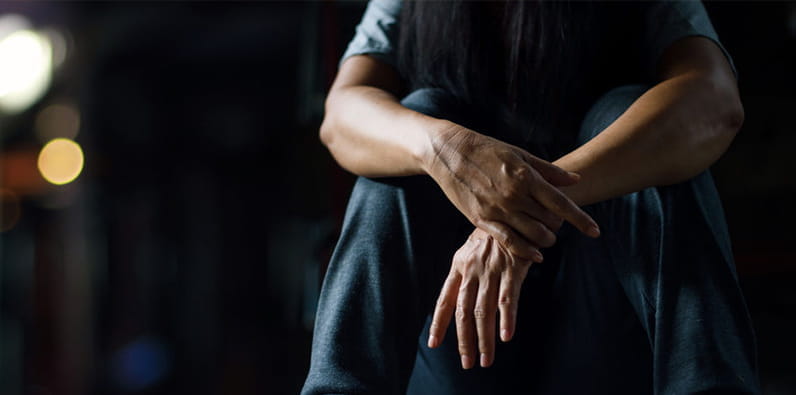 Man Holding His Wrist 