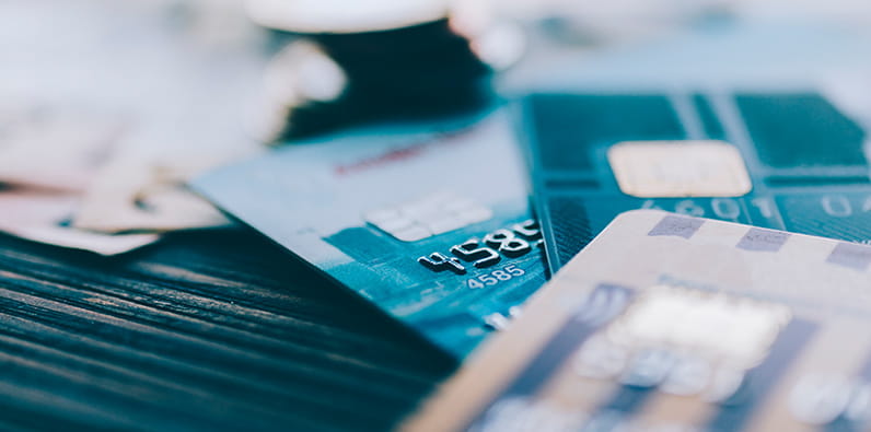 A Man Using His Bank Card Online
