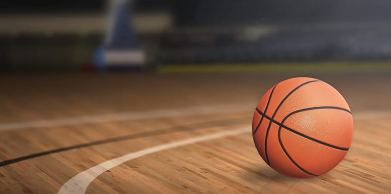 Basketball ball on a hardwood basketball court