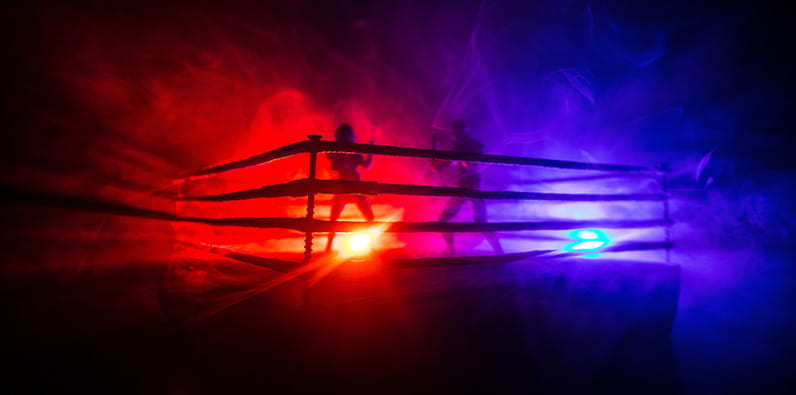 Boxers boxing on a ring with a red and blue background