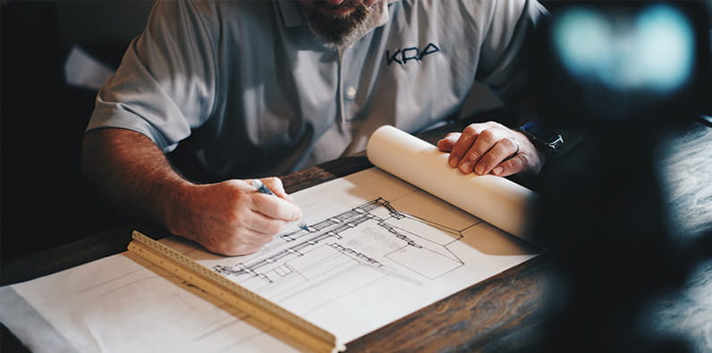 Man Working on Schematics