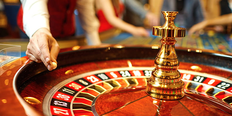 Live Roulette Croupier Spinning the Roulette Wheel 
