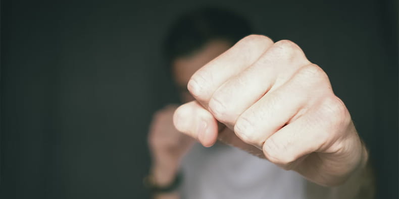 A Man Throwing His Bare Fist