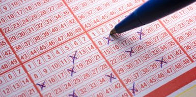 Closeup of a Person Filling in a EuroMillions Lotto Grid
