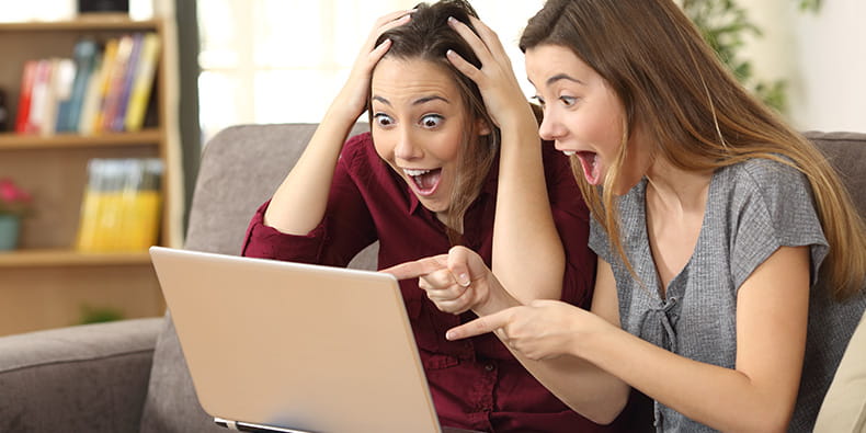 Two Young Females Excited About Winning 