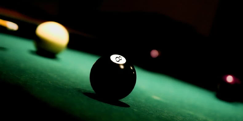 Black and White Ball on a Pool Table