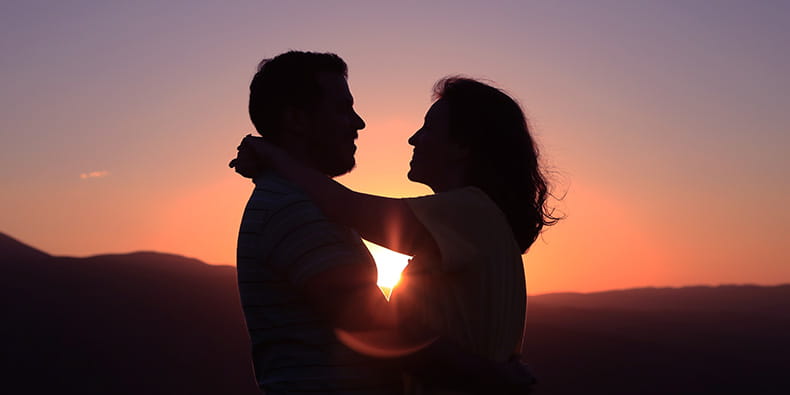 Two People Hugging in the Sunset 