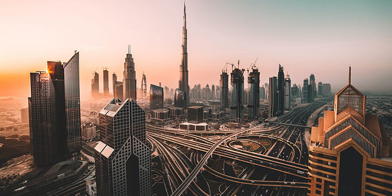 An Aerial Photo of a Futuristic City with Highways