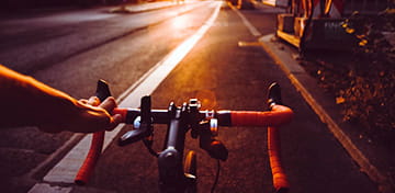 An Image Showing a Front-Head View of a Bicyclist connected nan Road