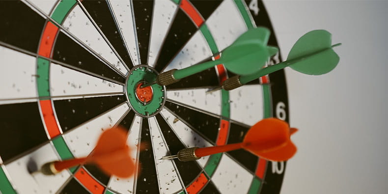 Three Darts Hitting the Board