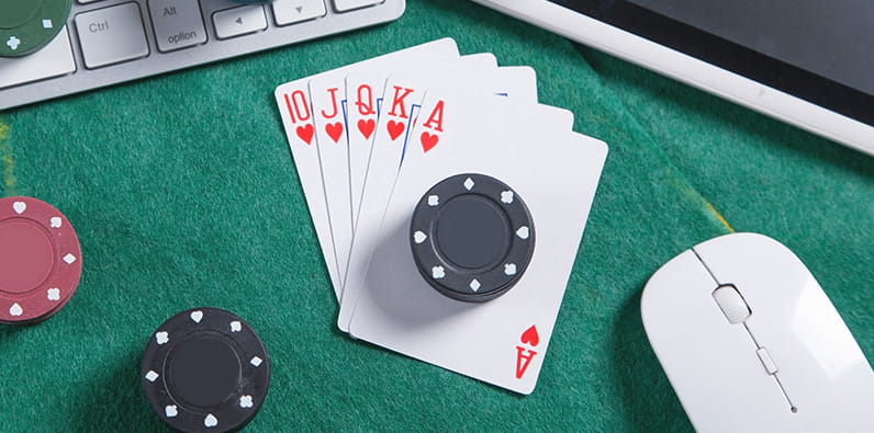 Computer Mouse on Winning Poker Hand, Dice, and Casino Chips