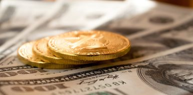  Banknotes on a Table, With Coins Put On Top