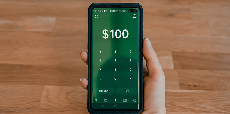  A Phone With a $100 Amount Shown on Screen