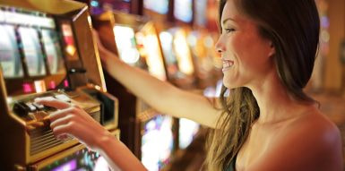 An adult playing a slot game