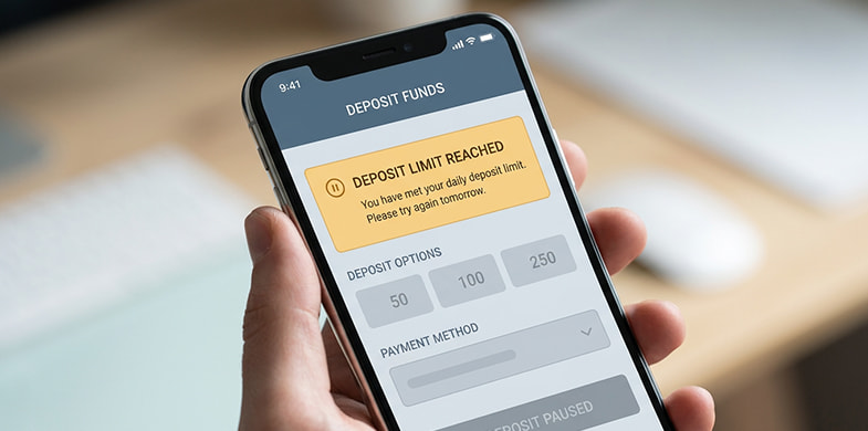 Smartphone screen showing a casino deposit limit notification
